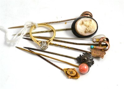 Lot 352 - A 9ct gold diamond solitaire ring and eight assorted stick pins including one set with a cameo...