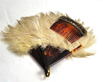 Lot 372 - A paste set tortoiseshell comb and an ostrich feather fan