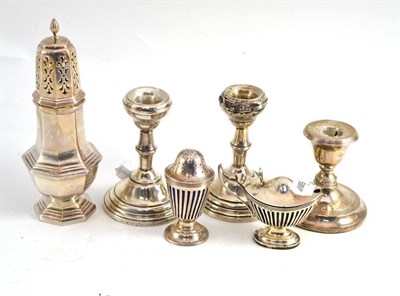 Lot 380 - Silver caster, three candlesticks and a pepper and mustard