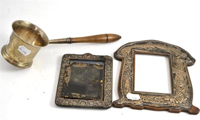 Lot 386 - A George II silver brandy saucepan and two silver photo frames