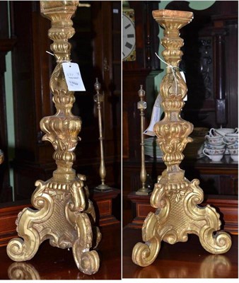 Lot 391 - A pair of 18th century Italian carved gilt wood candlesticks (a.f.)