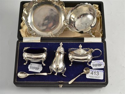 Lot 413 - A silver three piece cruet, silver sugar basin and sugar tongs and pierced silver dish, a...