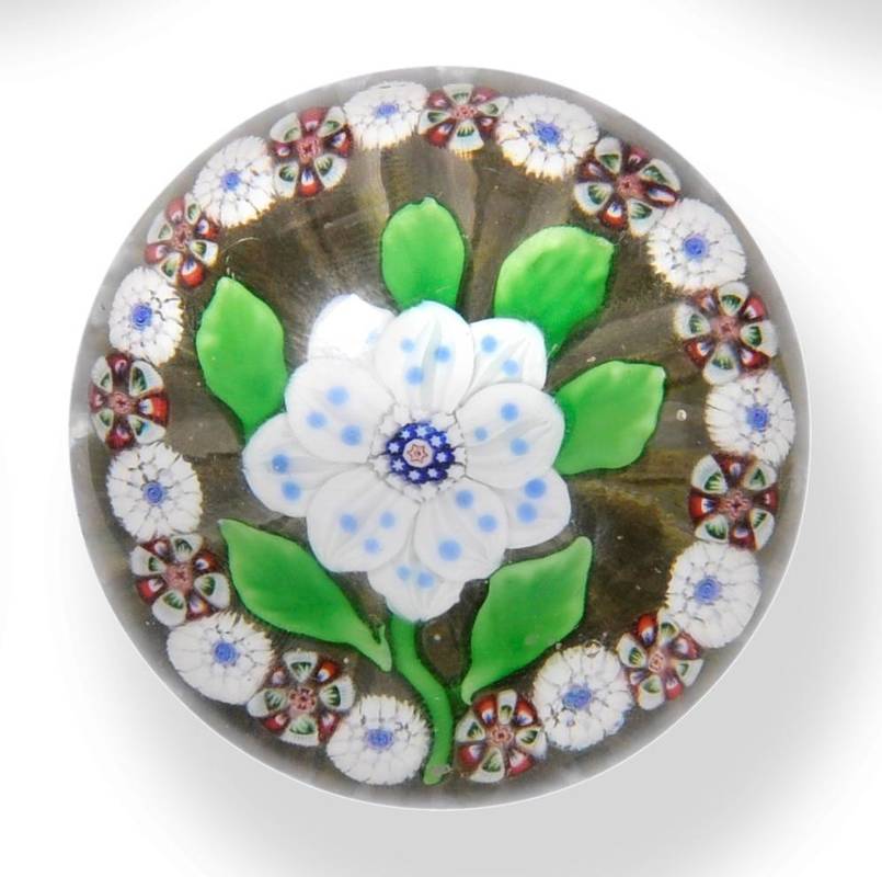 Lot 4 - A Baccarat Garlanded Flower Paperweight, circa 1850, the white petalled flower within a border...