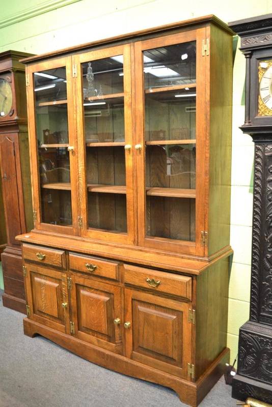 Lot 509 - A light oak glazed bookcase/dresser by Paul Kent, Grassington