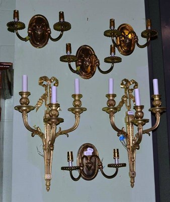 Lot 512 - Pair of French style triple wall lights and a set of four double wall lights