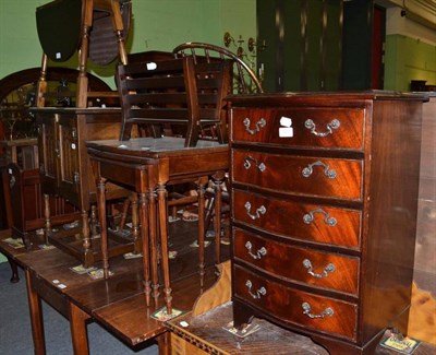 Lot 529 - A reproduction mahogany five height chest, nest of mahogany tables, two magazine racks, small...