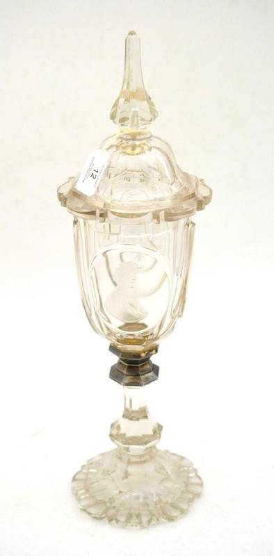 Lot 12 - A Bohemian Glass Goblet and Cover, dated 1883, with minaret finial, the octagonal body engraved...