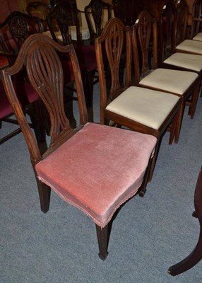 Lot 562 - A set of four Georgian mahogany dining chairs in Hepplewhite style (including a carver) and two...