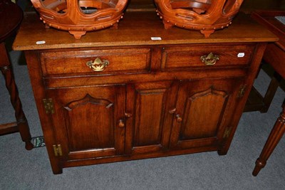 Lot 587 - A Titchmarsh and Goodwin oak small dresser base