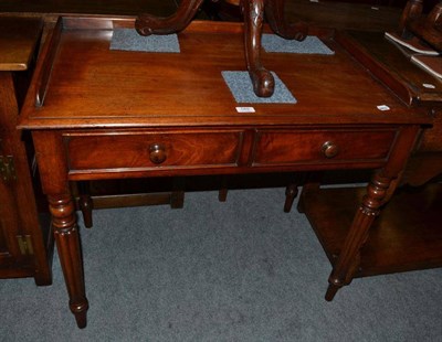 Lot 589 - Mahogany two drawer writing table