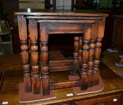 Lot 590 - An oak nest of tables