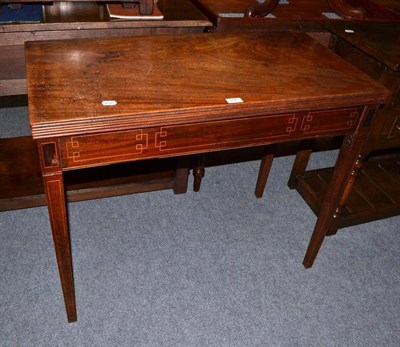 Lot 596 - Georgian mahogany fold-over tea table