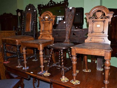 Lot 614 - A pair of Victorian hall chairs, an oak side chair in 17th century style and a spinning chair (4)