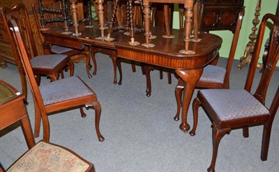 Lot 615 - Wind-out dining table and a matched set of eight chairs