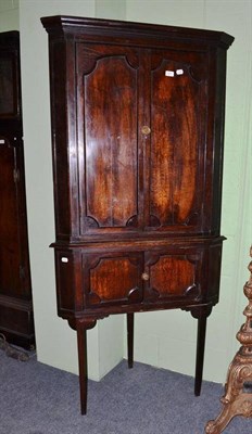 Lot 620 - Georgian style oak standing corner cupboard on square supports