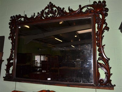 Lot 622 - A Victorian carved rosewood overmantel mirror with shell and scroll sides and top, width 160cm