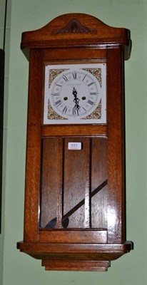 Lot 631 - Oak wall clock