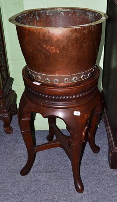 Lot 632 - 19th century copper planter on Chinese wooden stand