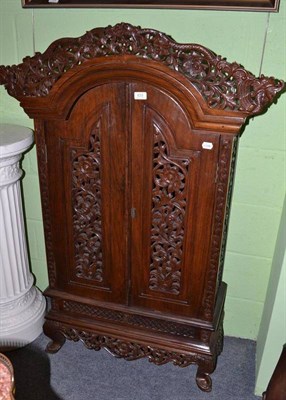 Lot 633 - Carved two door cupboard