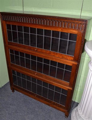 Lot 640 - A bookcase with leaded glass