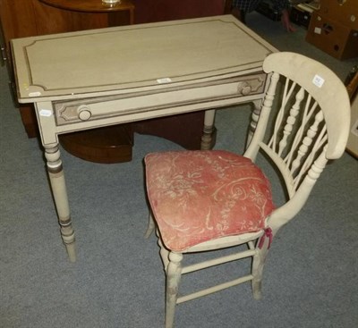 Lot 702 - A painted table and matching chair