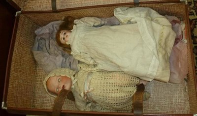 Lot 762 - Bisque shoulder head doll on a kid leather bent limb body, wearing a white cotton gown, bisque baby