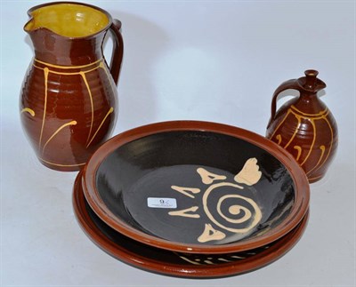 Lot 9 - Two Studio pottery slipware dishes and a slipware jug and a vinegar bottle