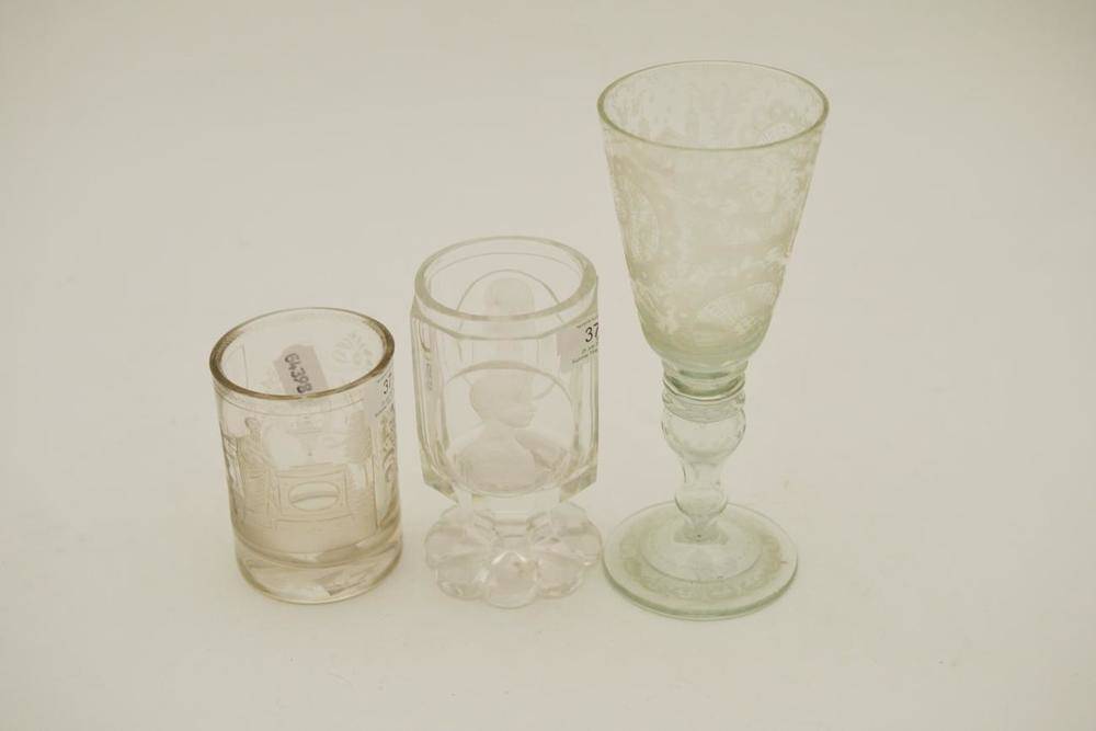 Lot 37 - A Bohemian Glass Goblet, mid 19th century, the panelled cylindrical bowl engraved with two bust...