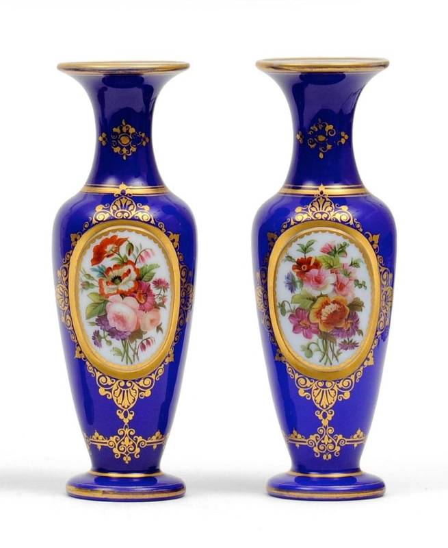 Lot 38 - A Pair of Baccarat Blue Overlay White Glass Vases, mid 19th century, of baluster form, painted with