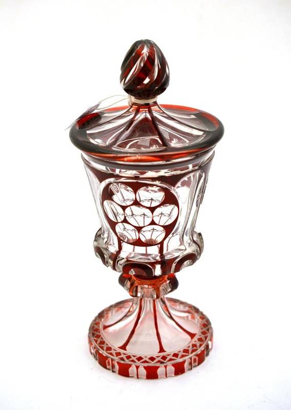 Lot 41 - A Bohemian Ruby Flashed Clear Glass Goblet Vase and Cover, dated 1839, with wrythen finial, the...