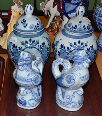 Lot 54 - A pair of Delft vases and two Phoenix oil bottles