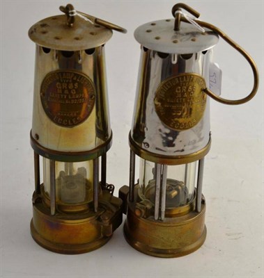 Lot 57 - Two Eccles protector lamps