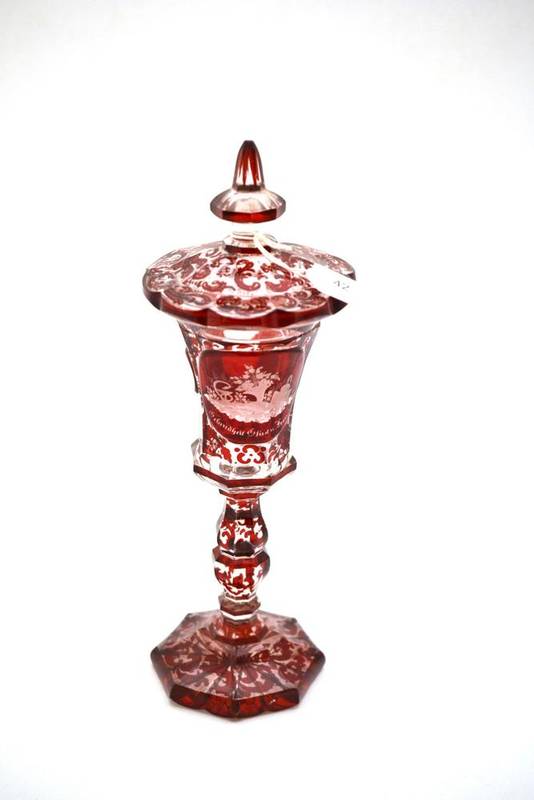Lot 42 - A Bohemian Ruby Flashed Clear Glass Goblet and Cover, mid 19th century, with minaret knop, the...