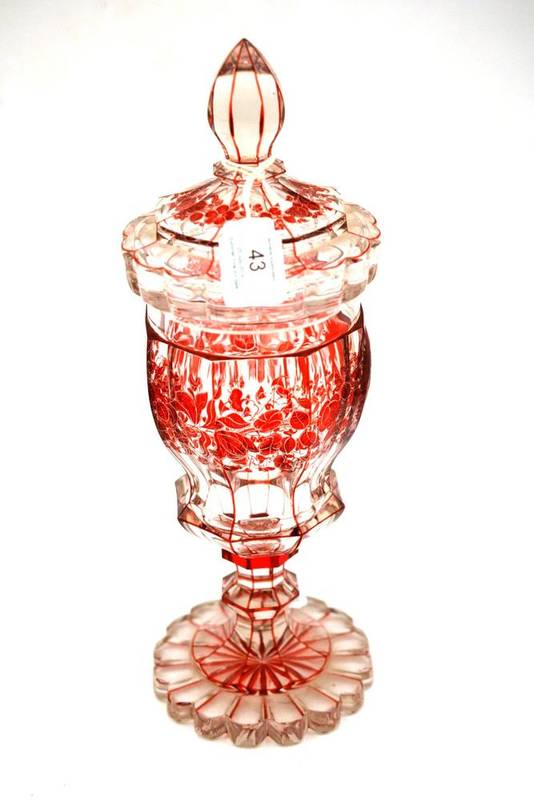 Lot 43 - A Bohemian Ruby Flashed Goblet and Cover, mid 19th century, of panelled baluster form, engraved...