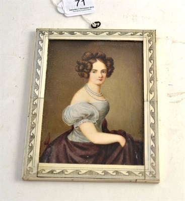 Lot 71 - A miniature of a lady wearing pearls, white top and plum coloured skirt signed W. Fischer, in ivory