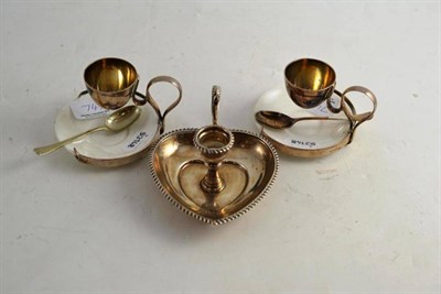 Lot 74 - Silver chamber candlestick and a pair of Hukin and Heath egg stands