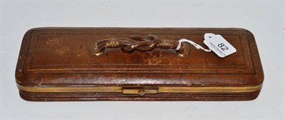 Lot 82 - A Victorian brass and leather expanding glove box with fitted glove stretcher