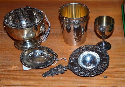 Lot 88 - Two silver strainers, a beaker, egg cup and small bowl