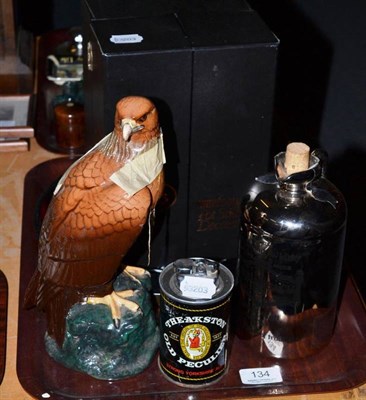 Lot 134 - Royal Doulton golden eagle decanter, two other decanters, Theakston lighter and tray