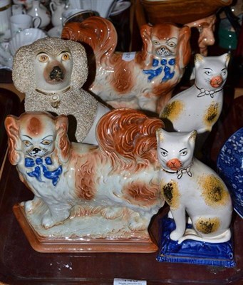 Lot 140 - Staffordshire poodle and two Staffordshire type figures