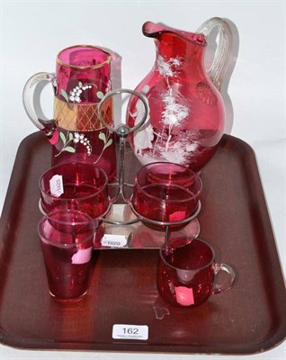 Lot 162 - Mary Gregory style cranberry glass jug, three pieces of cranberry glass and plated preserve...