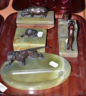 Lot 163 - A pair of onyx bookends each mounted with a tiger, a blotter mounted with a hippopotamus, a box and