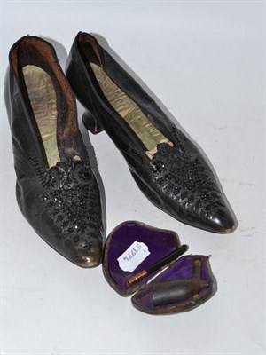 Lot 177 - A pair of black leather and beadwork shoes and a 19th century pipe, cased