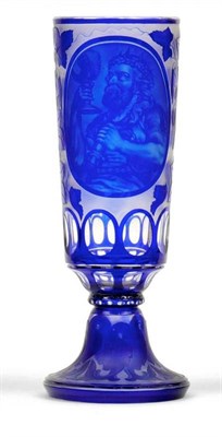 Lot 54 - A Bohemian Blue Overlay Clear Glass Goblet, mid 19th century, of cylindrical form, engraved...