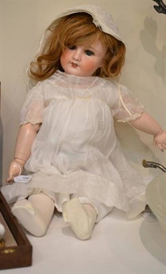 Lot 198 - Unis French bisque socket head doll '301', with sleeping blue eyes, brown wig, open mouth, on a...