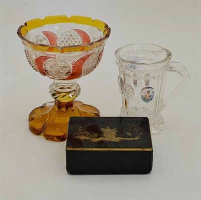 Lot 56 - A Bohemian Glass Mug, mid 19th century, the panelled slightly flared bowl with five oval panels...