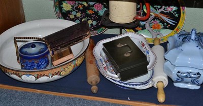 Lot 204 - A shelf of decorative ceramics including biscuit barrel, tureen and cover, two rolling pins,...