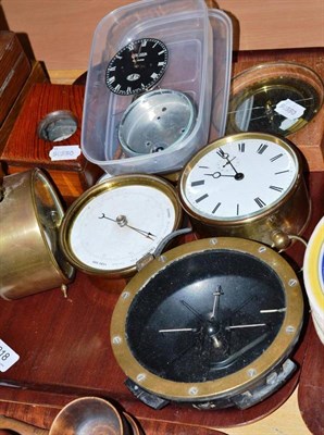 Lot 218 - A tray of brass cased clocks, barometers etc