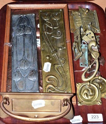 Lot 223 - A tray of Arts & Crafts and Art Nouveau door plates, furniture handles etc