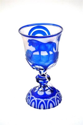 Lot 64 - A Bohemian Blue Overlay Clear Glass Goblet, mid 19th century, engraved with a horse in...